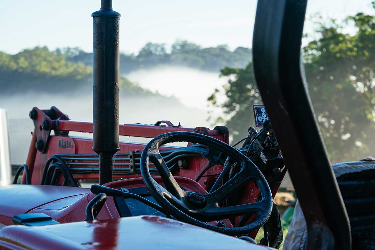 Close up of the steering wheel of a red tractor