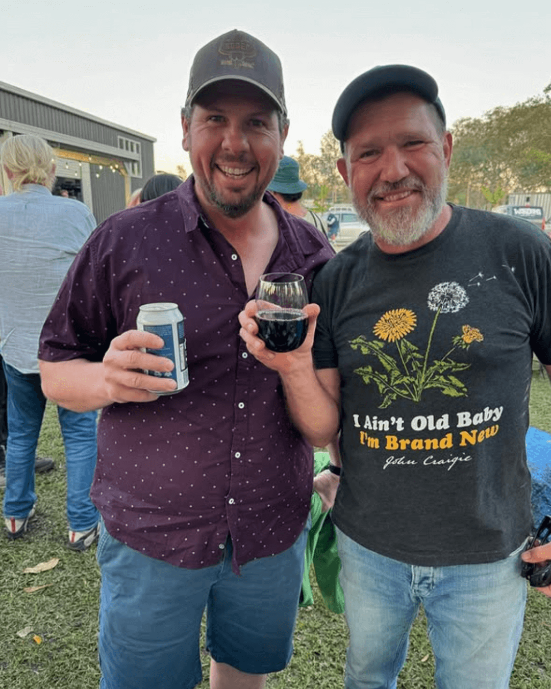 Greg Cromwell and Jay O'Harae holding drinks and smiling